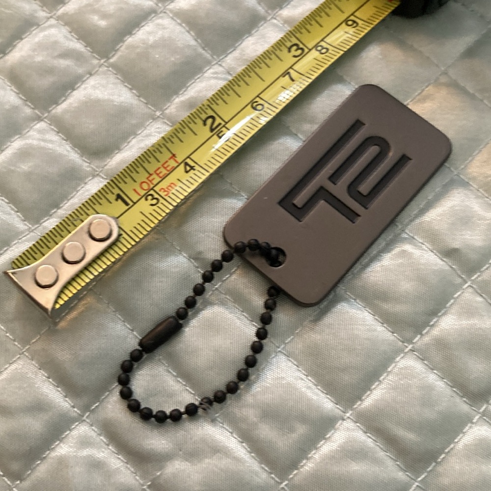 Tumi T2 metal tag fob for bag